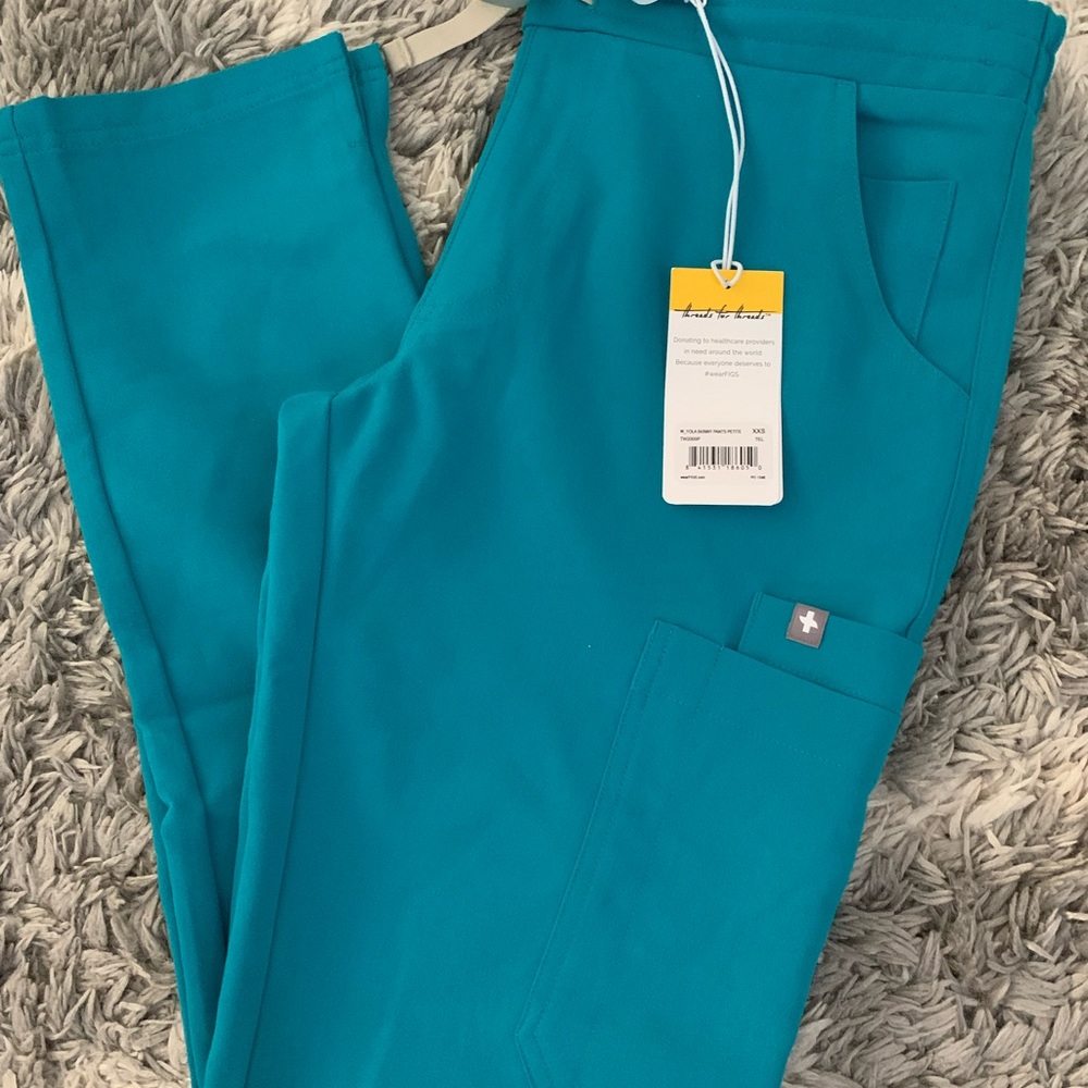 Brand new figs in teal color XXS/P yola